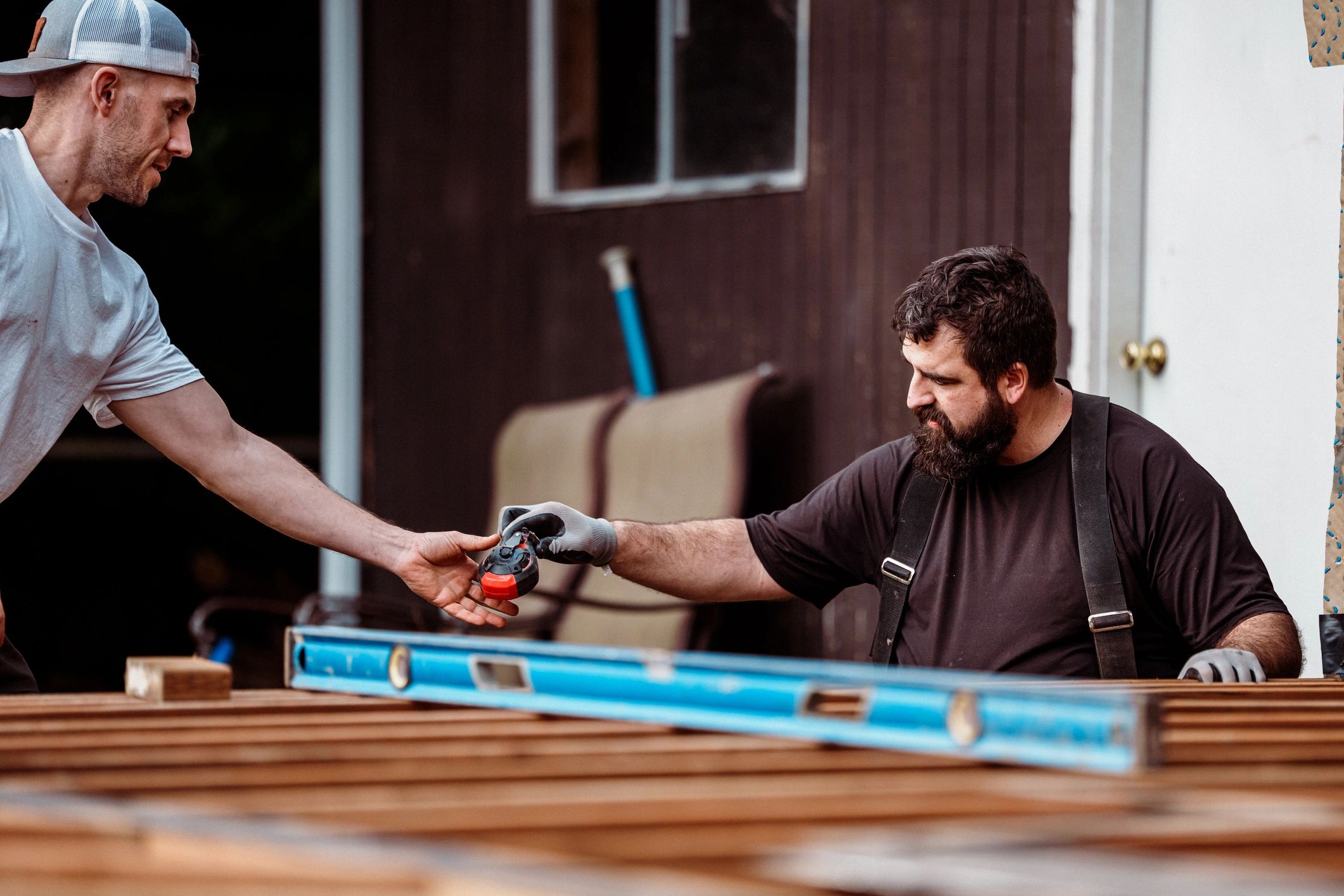 Two home service professionals collaborating on a project